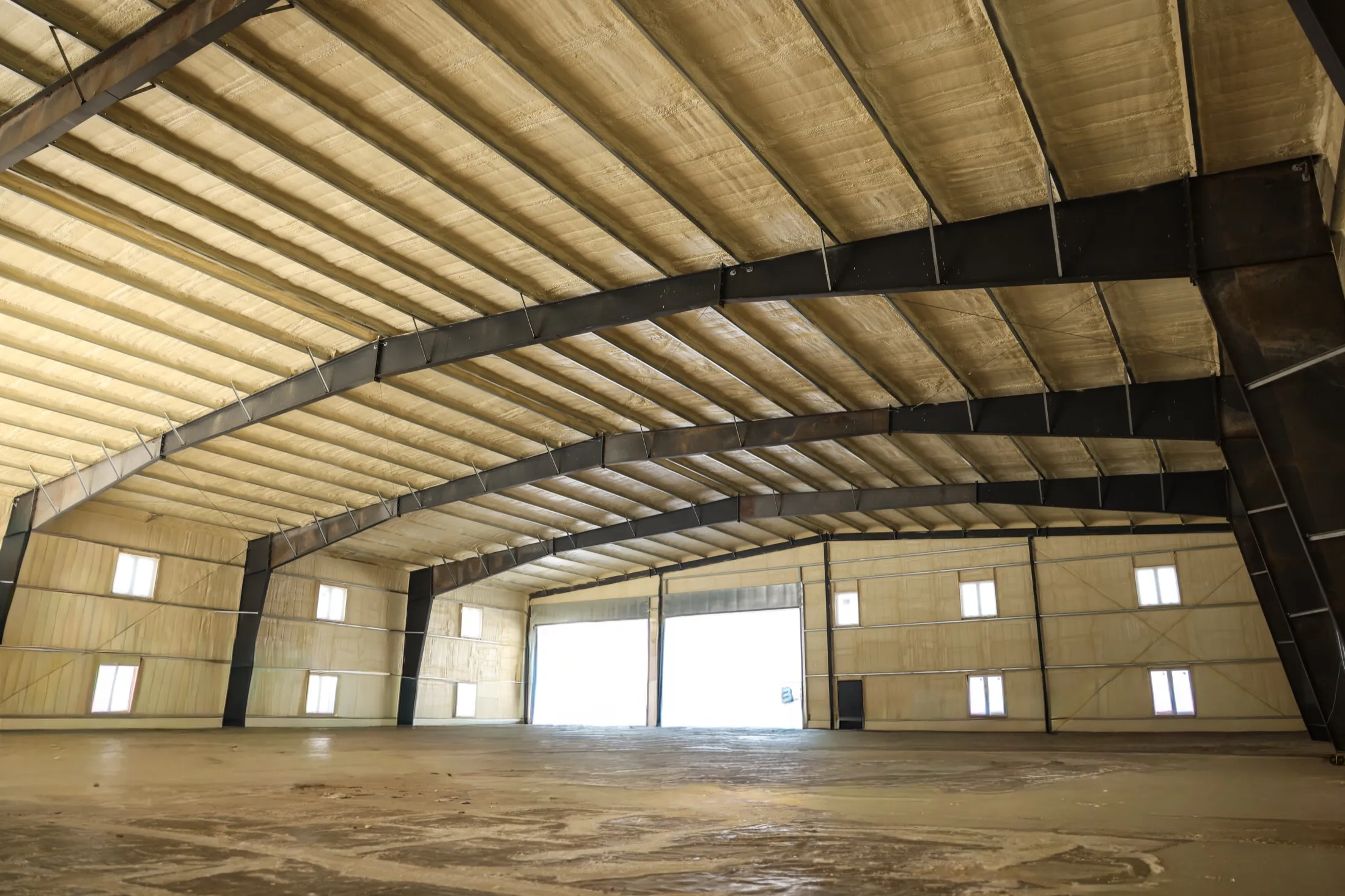 Large metal structure interior suitable for spray foam insulation